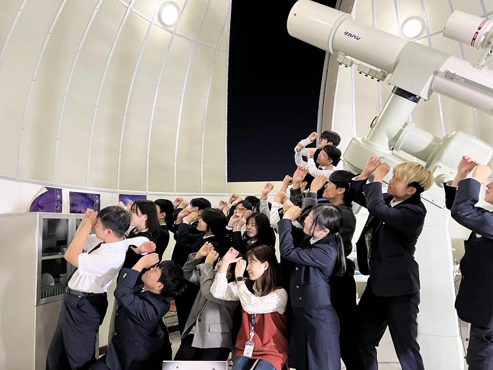 Visitors gathered around the observatory's main telescope during the Starlight Festival.