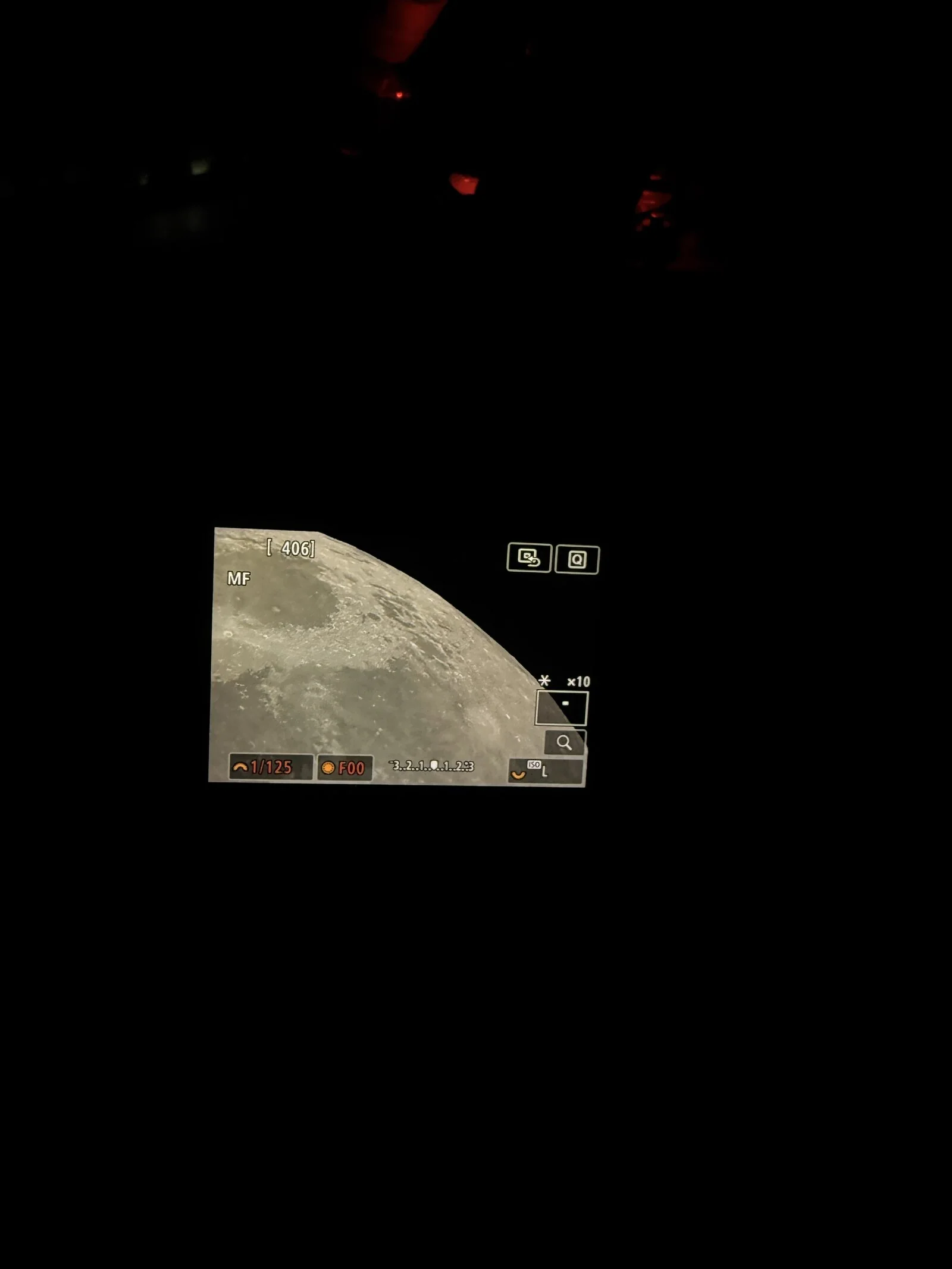 The Moon photographed with a DSLR camera through the telescope.